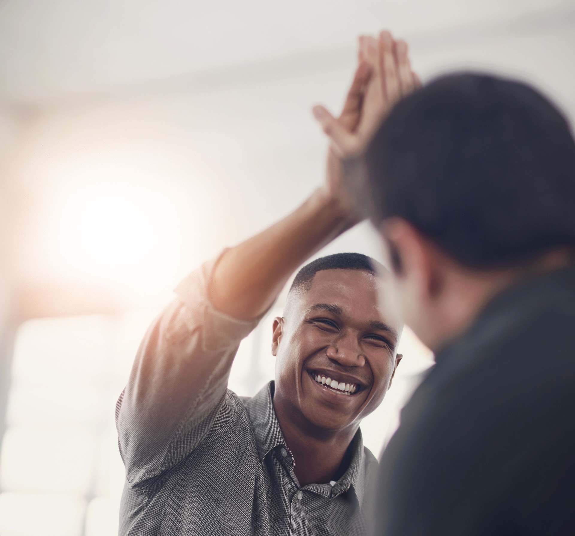 High five, smile and support with business people in office together for celebration, motivation or success. Bonus, goals or target with man employee friends in workplace for congratulations or deal